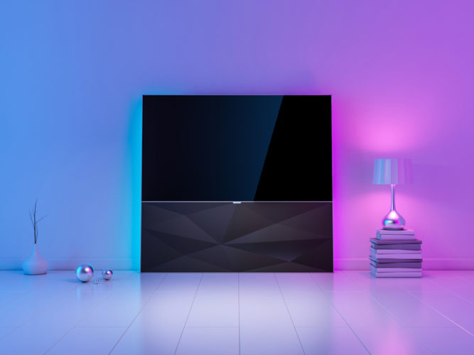 a TV with LED lights behind in a modern room