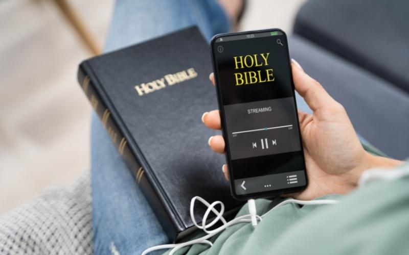 a person listens to holy bible audibook