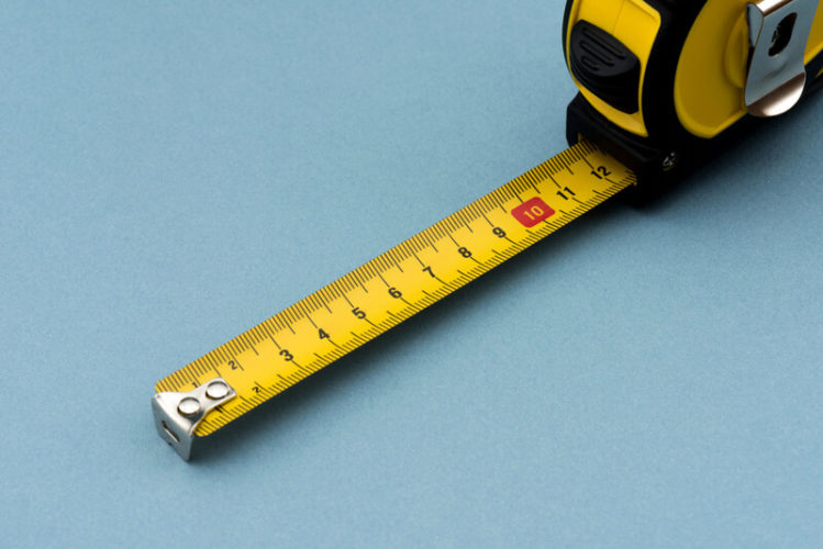 a yellow measuring tape in a blue background
