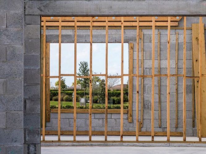 wooden studs inside the concrete unfinished house