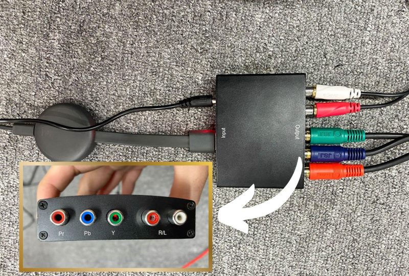 Plug component cables into the output ports of an HDMI to Component converter