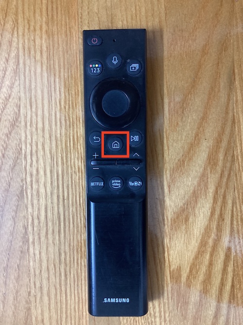 A Samsung remote with the Home button