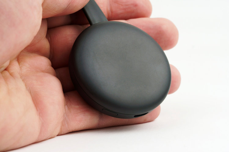 A man holding chromecast in his hand