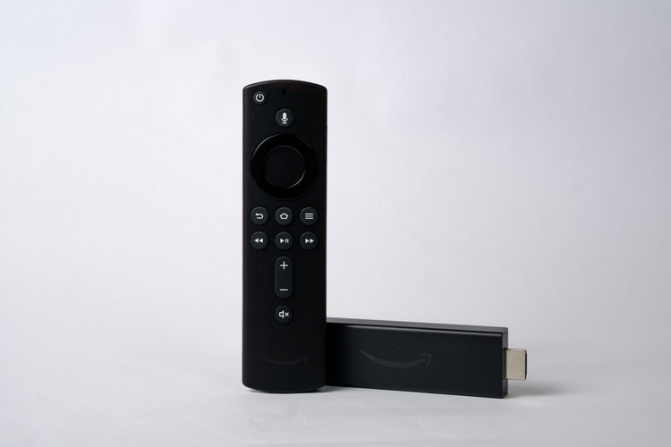 Black Firestick and remote on the white background
