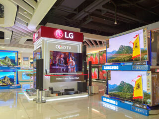 LG TVs and Samsung TVs on display at a mall
