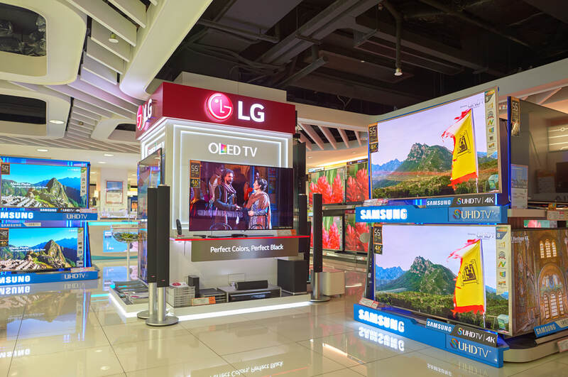 LG TVs and Samsung TVs on display at a mall