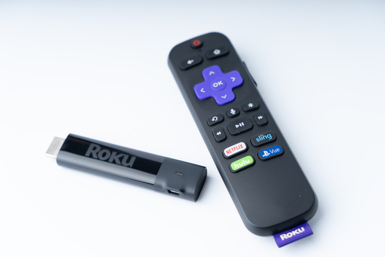 Roku Stick and remote on the white table
