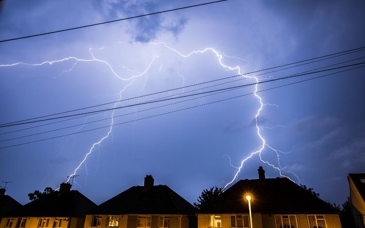 lightning above the houses