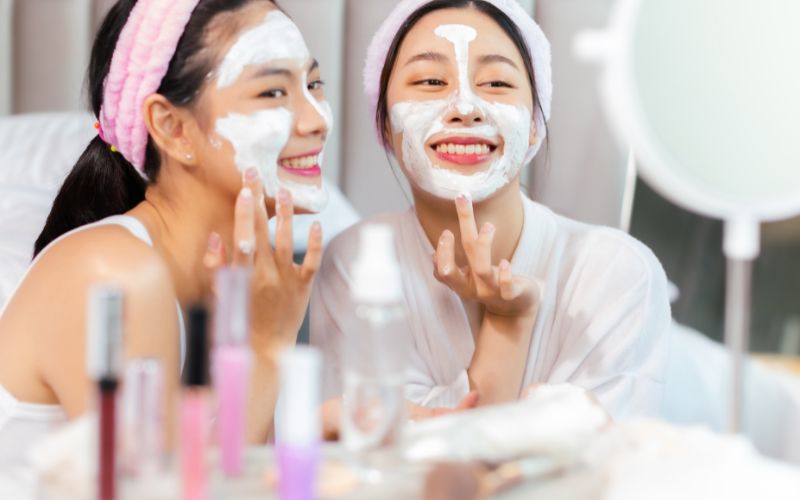 two girls are doing skincare