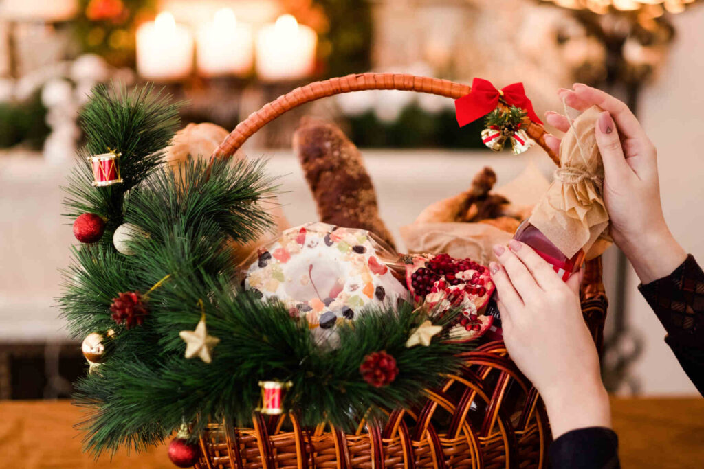 woman hand arranging Christmas goods in a basket