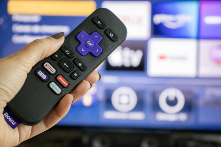 Roku remote in front of the TV