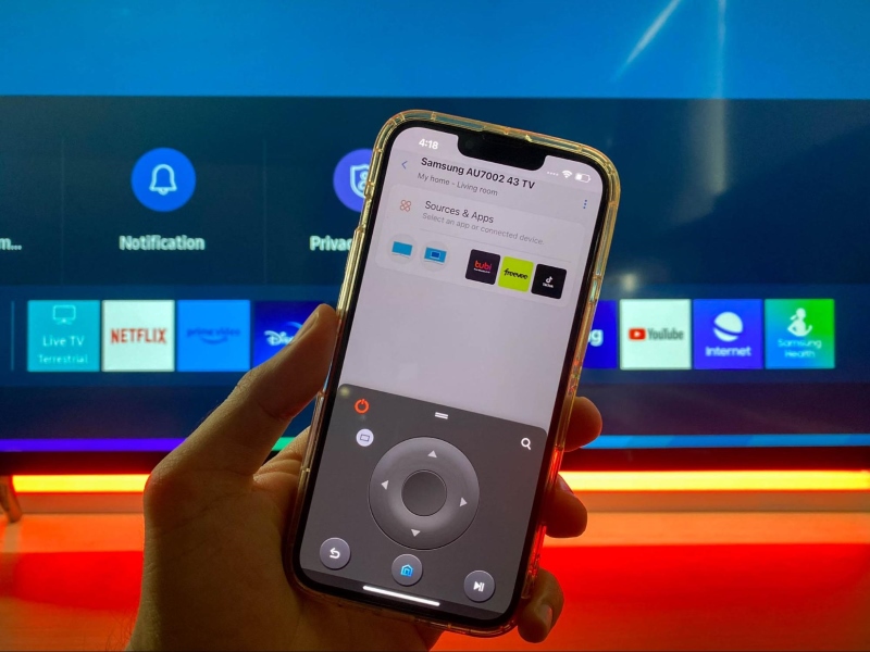 SmartThings with virtual remote holding in front of the Samsung TV