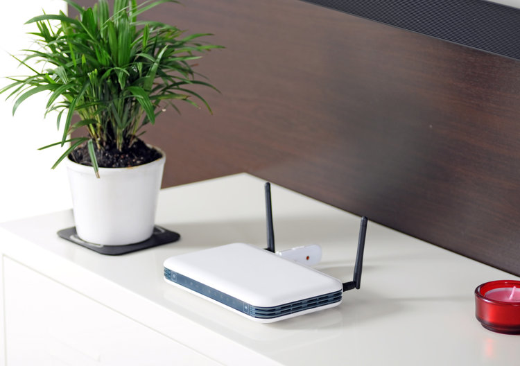 White wifi router on a white counter