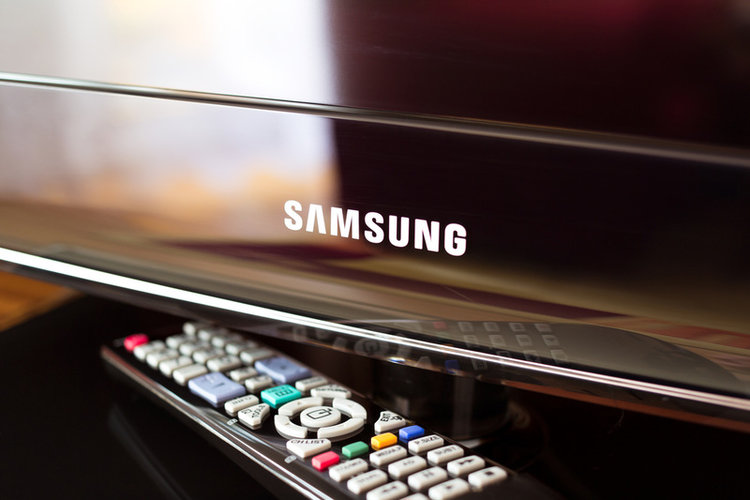 close-up view of Samsung logo on a TV and its remote