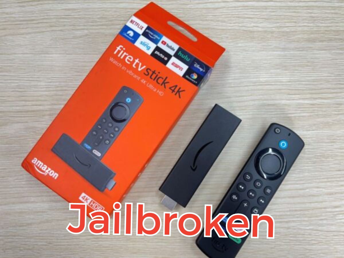 The Fire Stick TV is on the table with the jailbroken word in the middle of the image