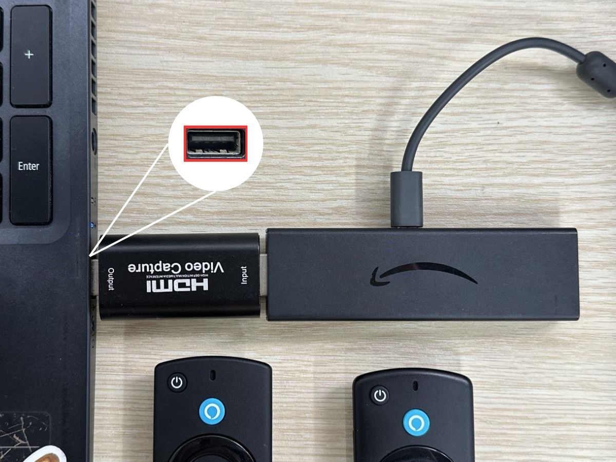 a firestick is plugged into a capture card plugged into an acer laptop