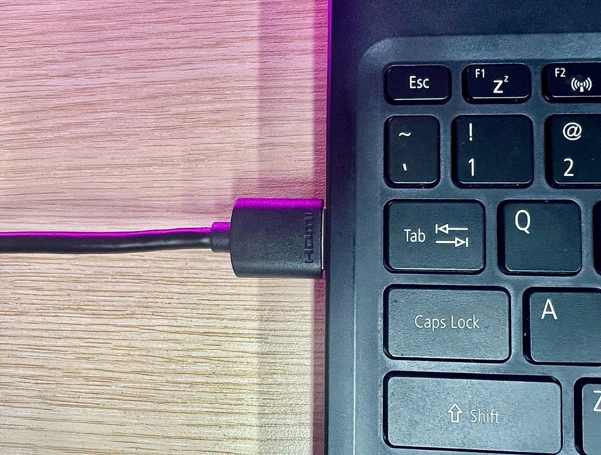 an hdmi cable is plugged into a laptop's hdmi port