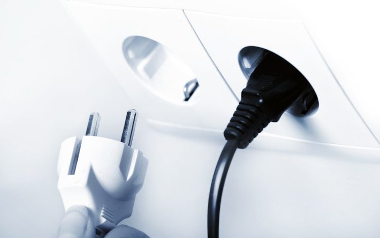 unplug a power cord from a socket
