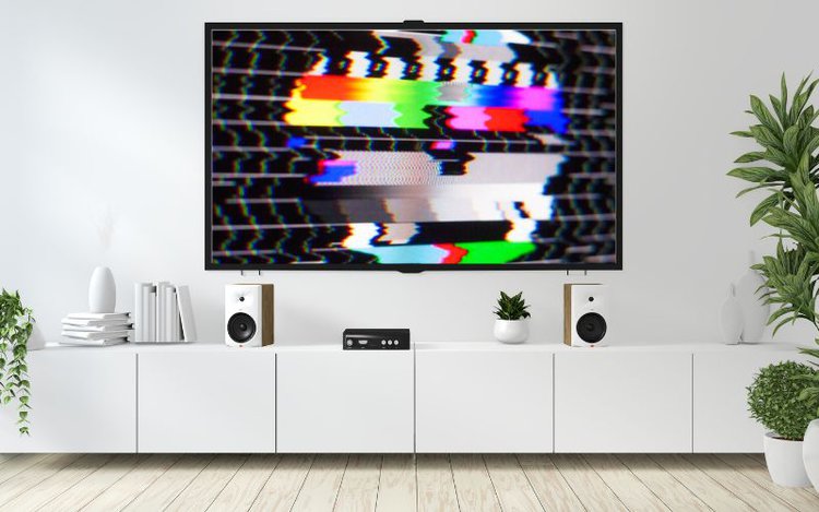 a flickering image on TV set in a white living room