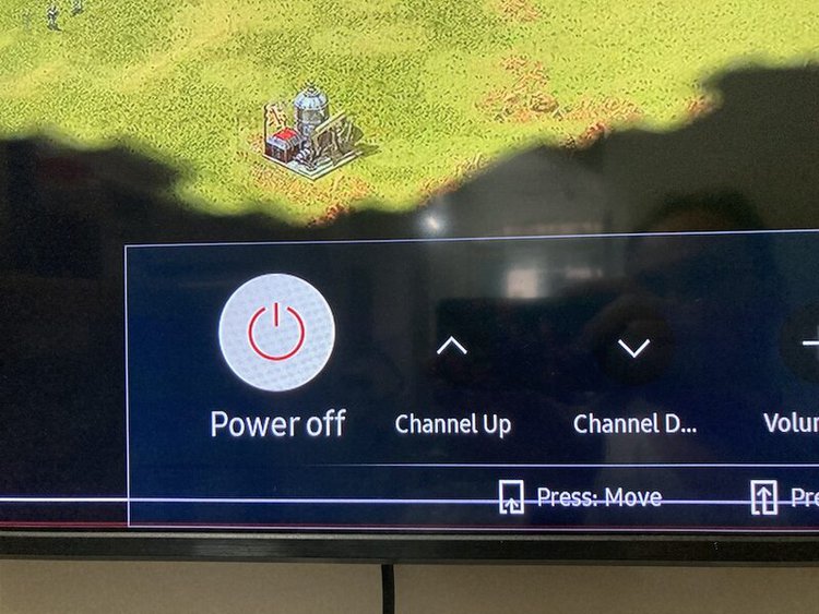 the Power Off button on the TV screen
