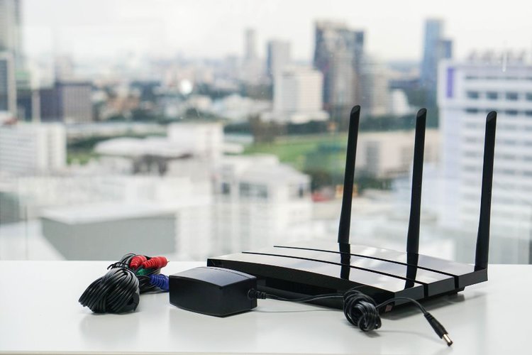 A black wifi router in city background