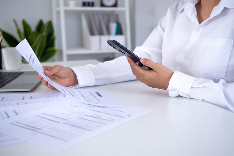 A woman checking her bill