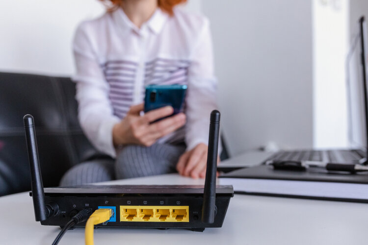 A woman using wifi and ethernet at the same time