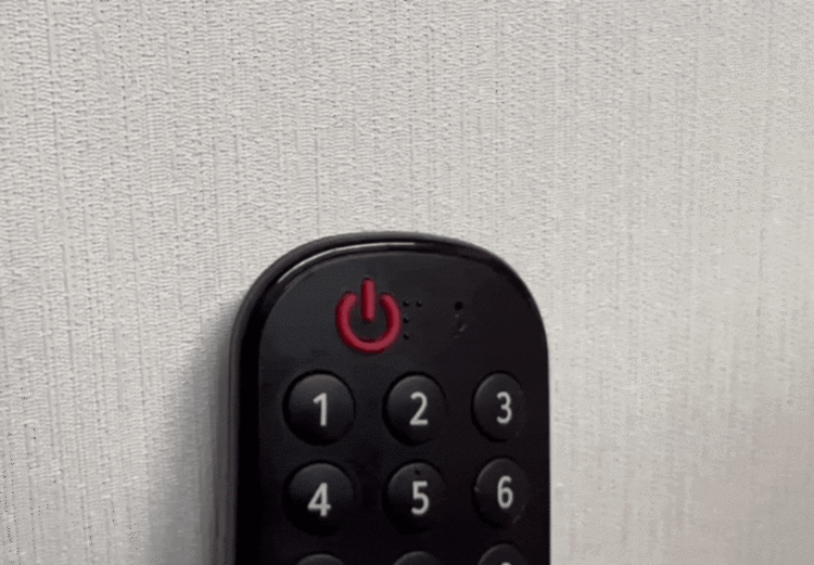 an LG TV remote with the power button