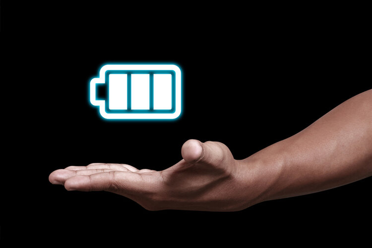 hand showing a full charge battery icon