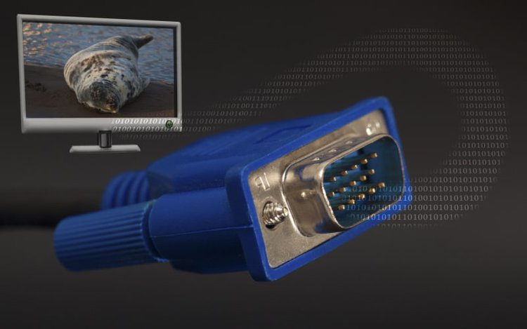 vga connector and a monitor in black background