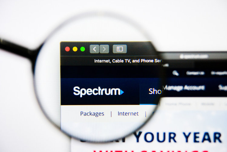 Spectrum app logo through the view of magnifying glass