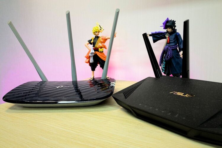 A Cheap TP Link And An Asus Router On A Table 750x500 