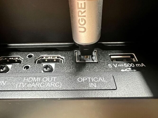 an optical connector right above an optical port of the soundbar