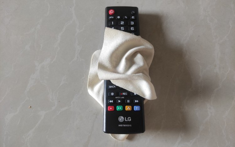 dry an LG TV remote with a cloth