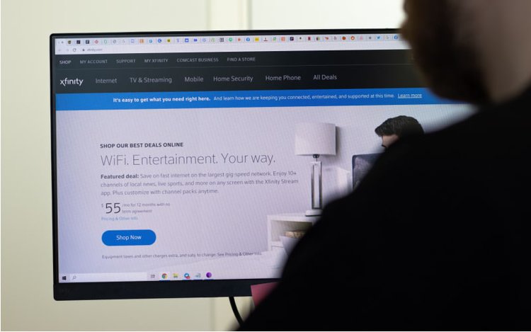 man checking the service plans offered by Xfinity on its website
