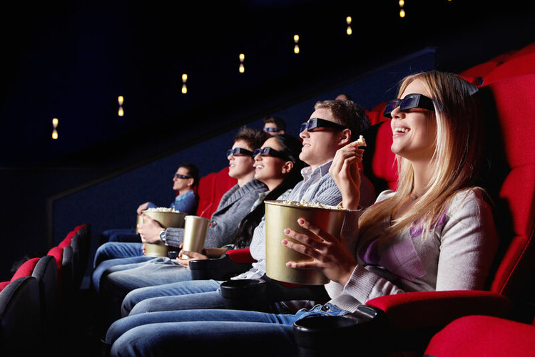 people wearing 3D glasses in the cinema