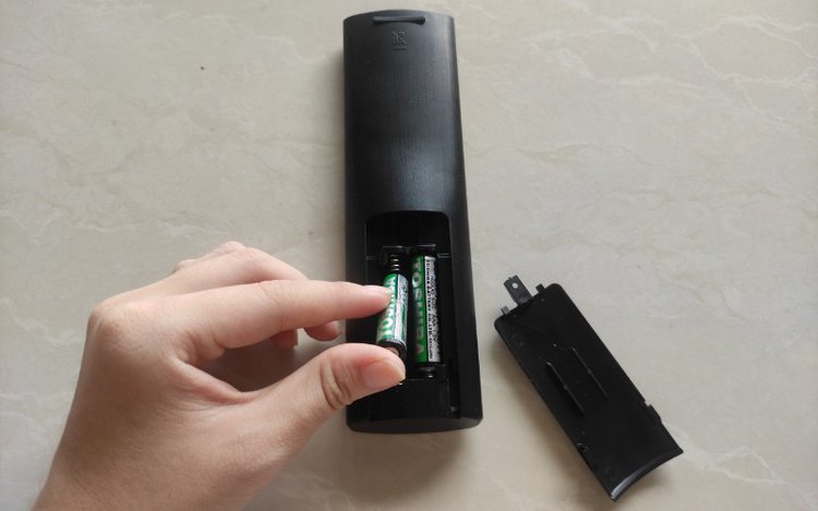 place batteries into a remote