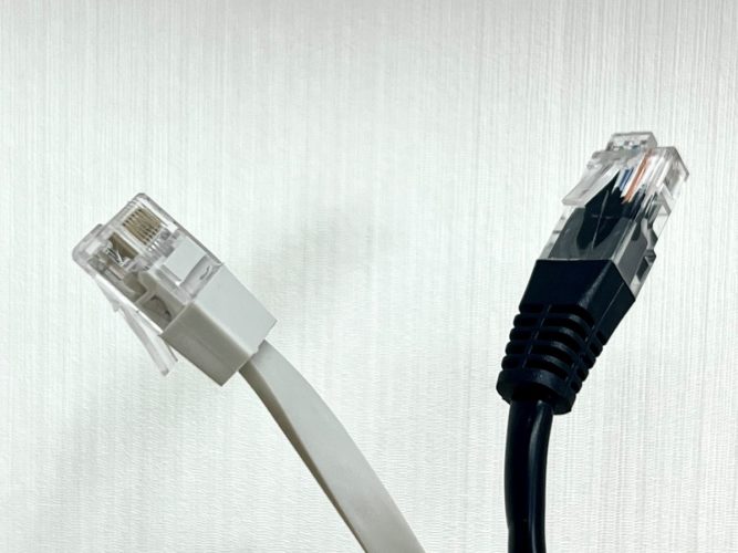 two ethernet cables, black and white ones