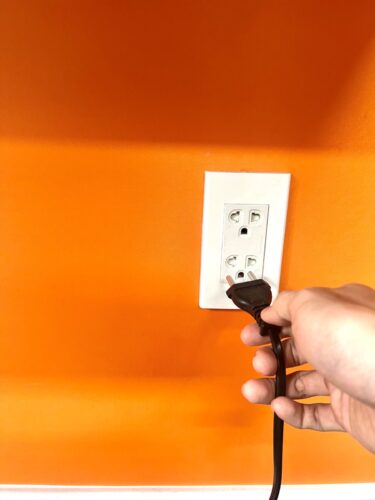 unplug a power cord from the outlet