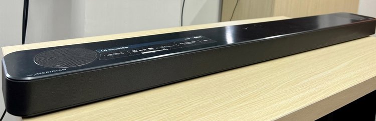 LG soundbar on wooden table