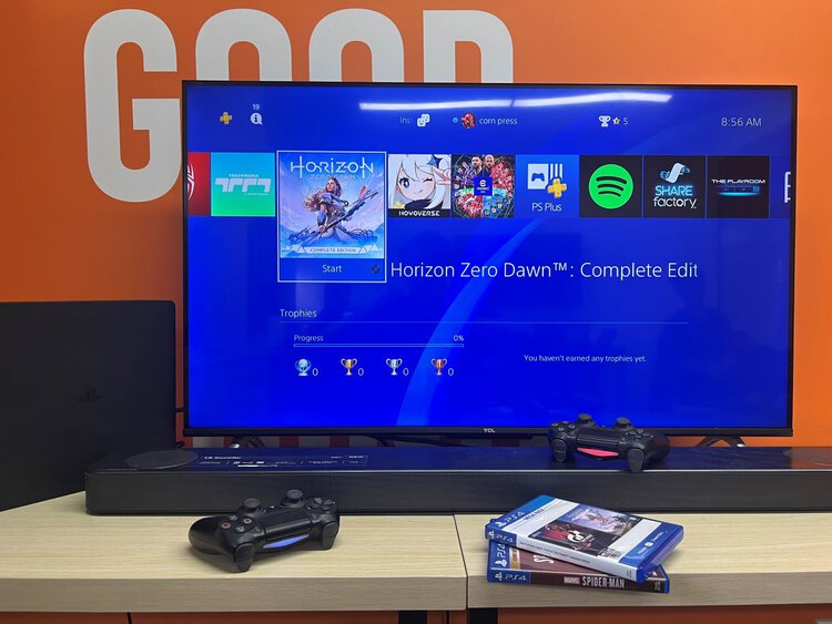 PS4 with Soundbar Controller and TCL TV at the back
