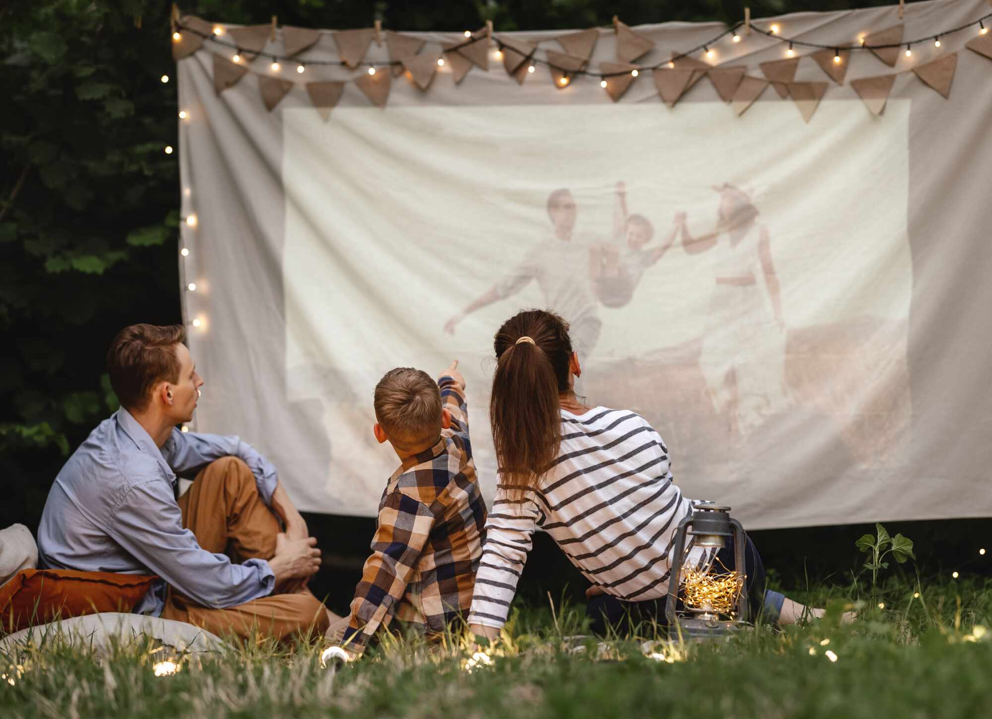 a family is having an outdoor movie