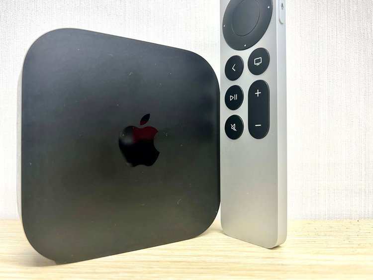 apple tv is standing on a yellow table