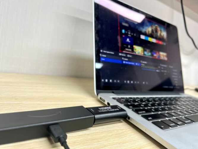 fire tv stick and a capture card are plugged into a macbook