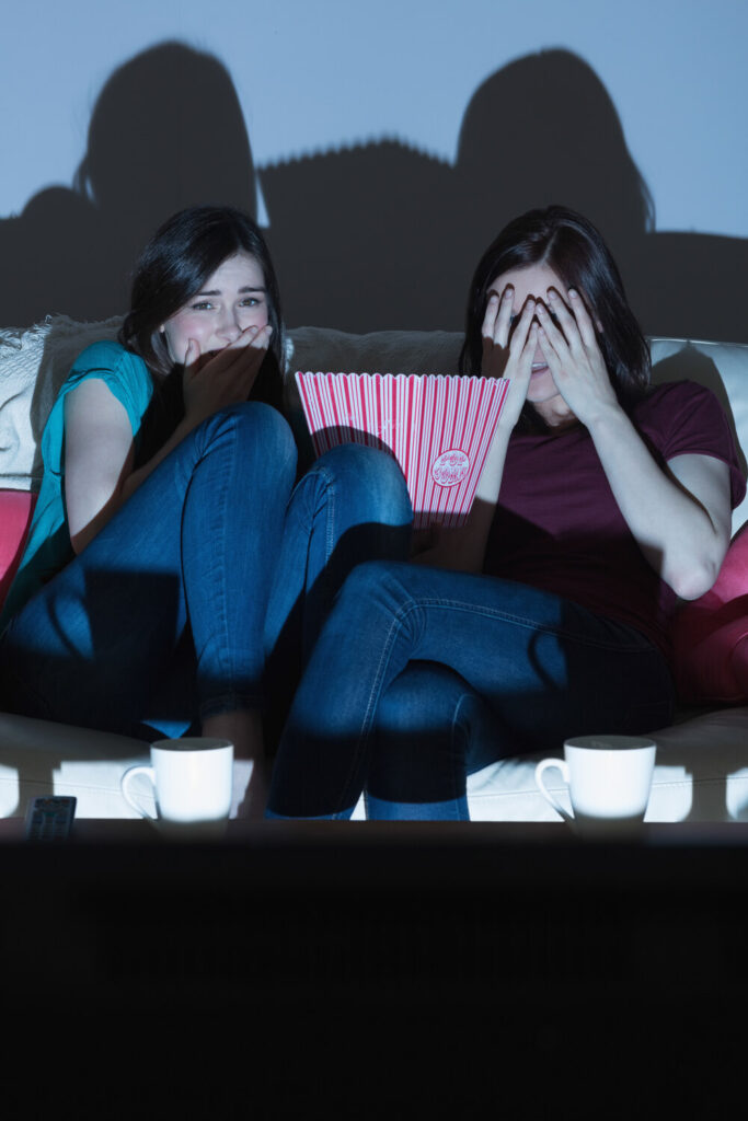2 women are scared while watching tv