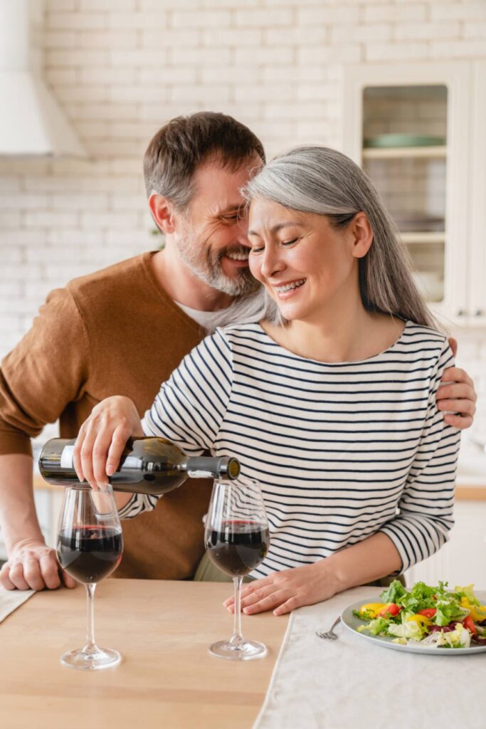 a old couple is drinking wine