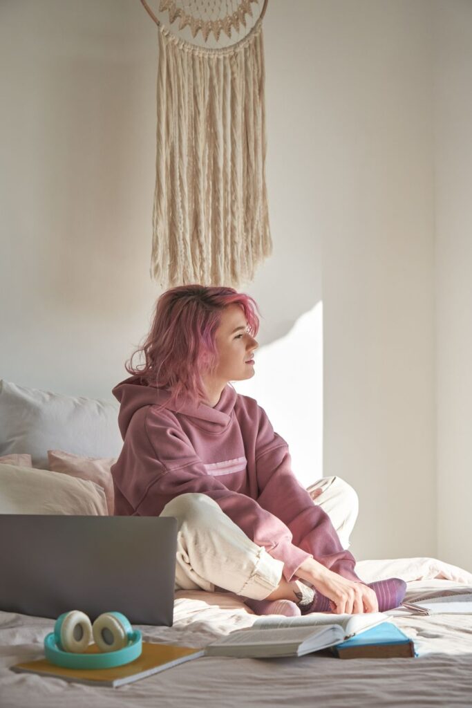 a woman is thinking deeply in her bedroom