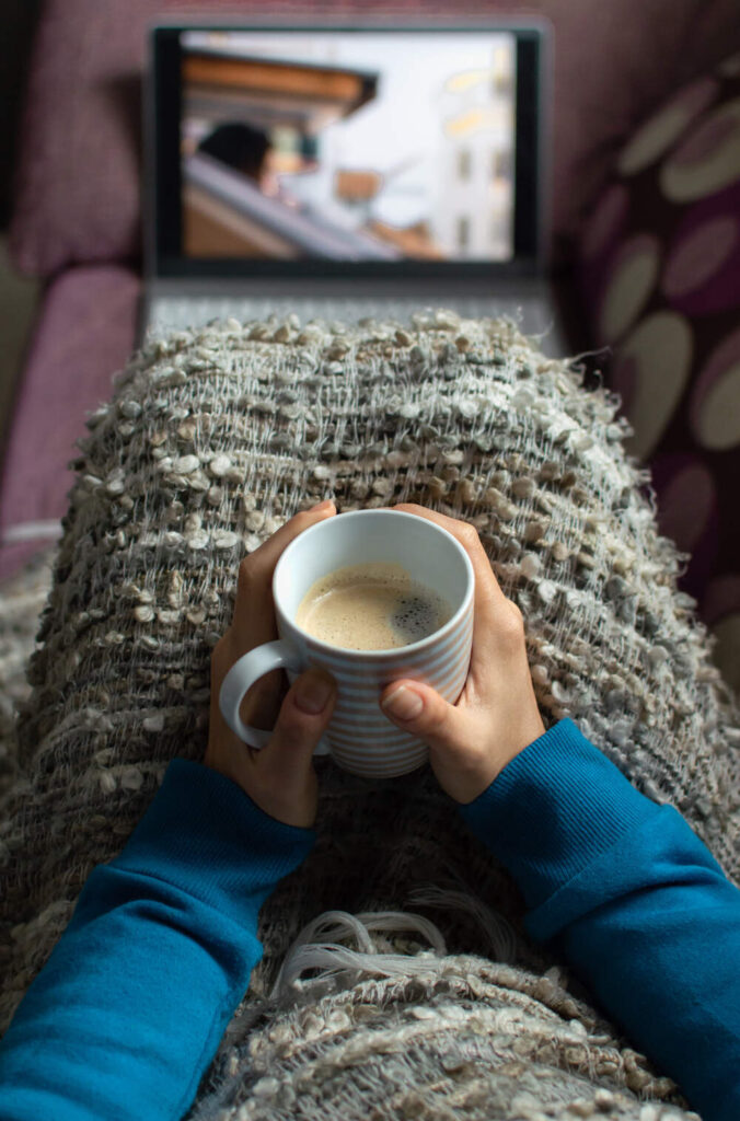 woman drinking while watching movie