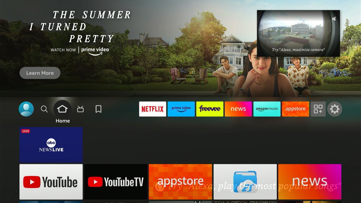 a fire tv stick with ring doorbell camera video on the top right corner