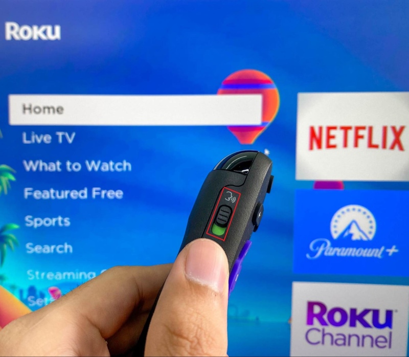 slide the hand-free voice button on Roku remote to the green position